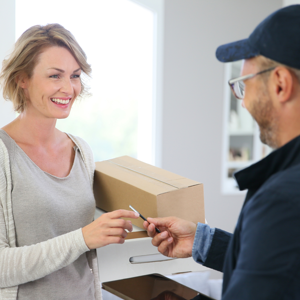 A customer receiving a package at her door